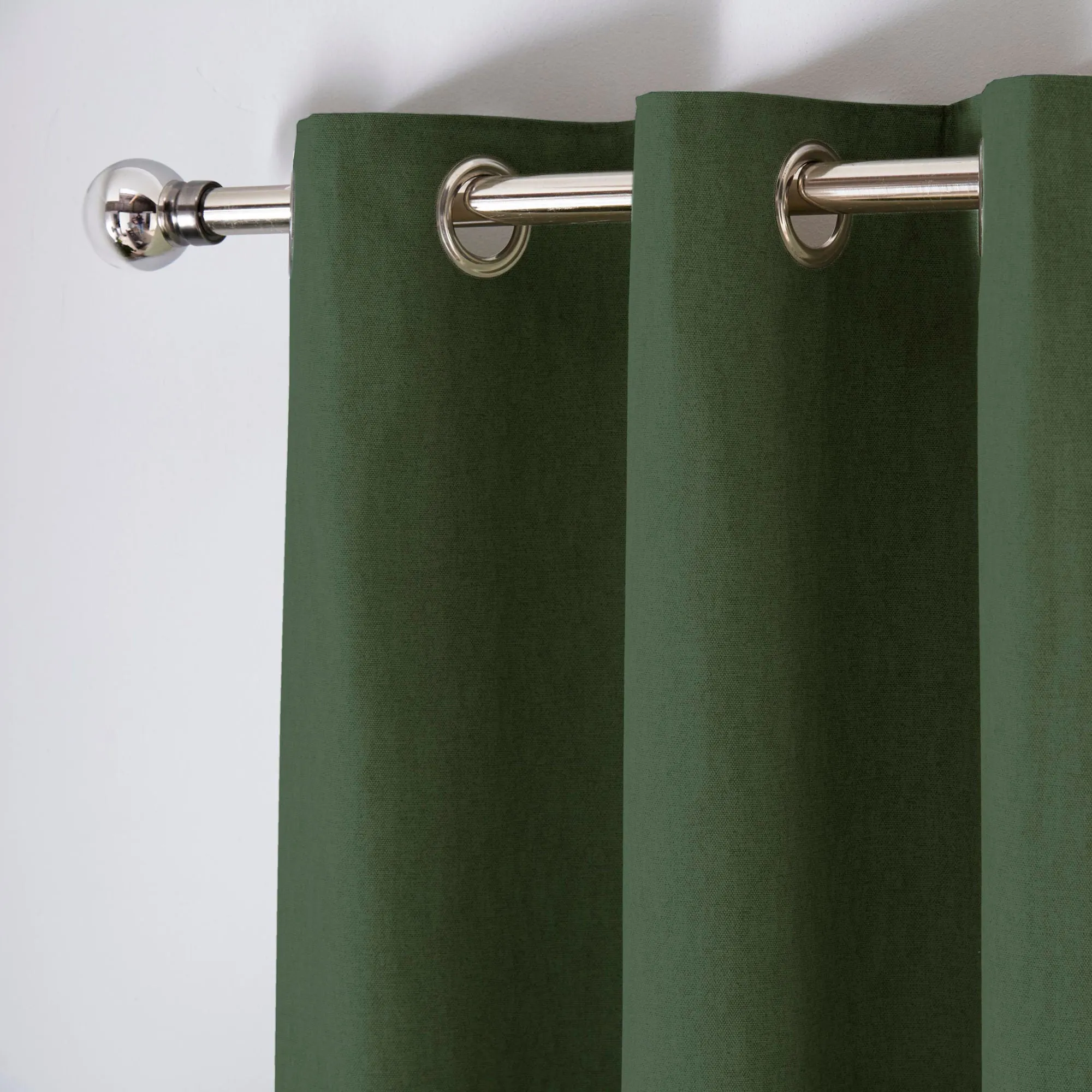 Sorbonne Pair of Eyelet Curtains by Fusion in Bottle Green